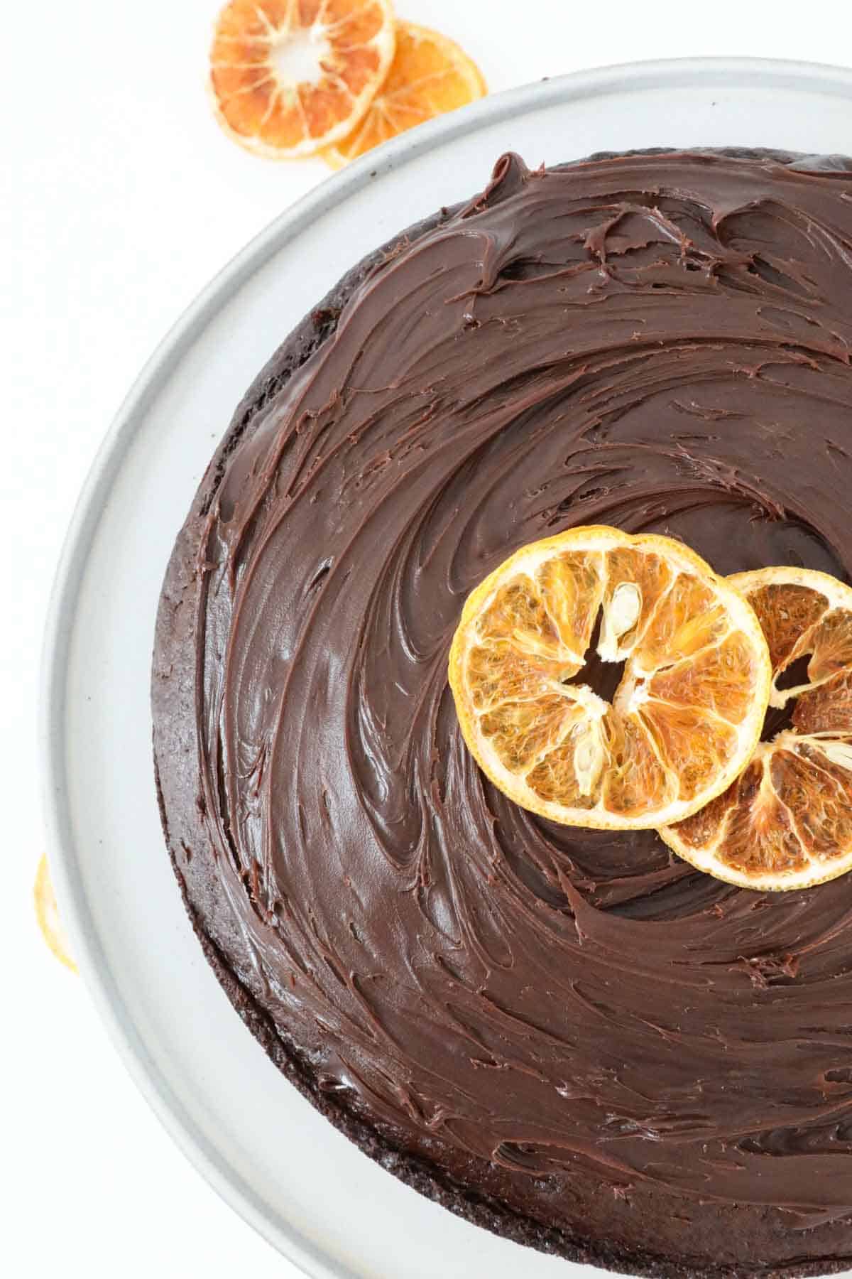 An overhead shot showing ganache topping decorated with slices of dried orange.