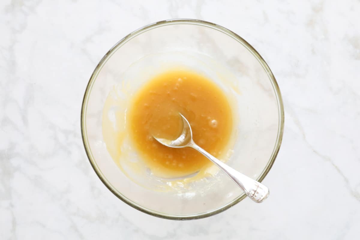 Melted butter and honey mixture in a glass bowl.
