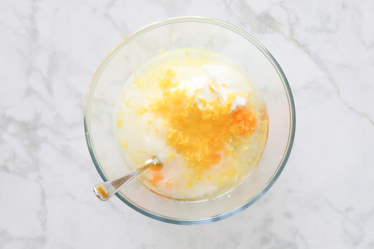 Greek yoghurt, eggs , sugar, lemon juice and zest in a separate bowl.