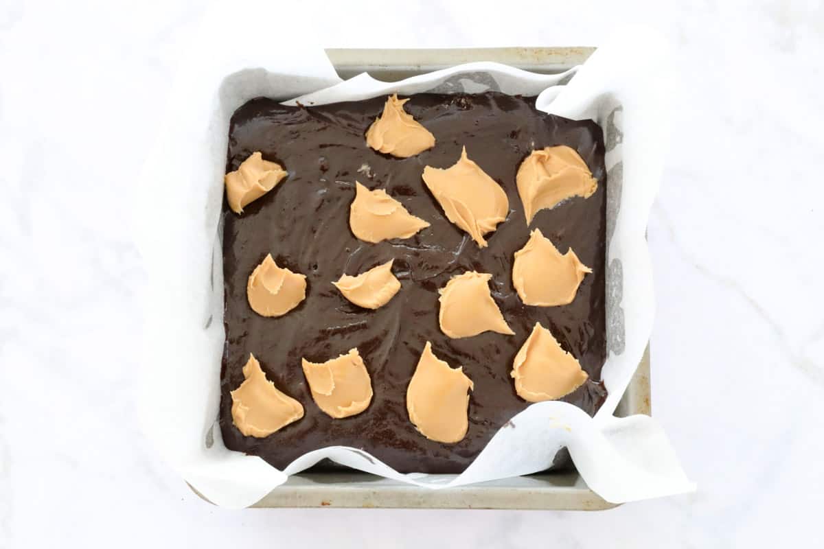 Peanut butter brownie mix in a baking pan.