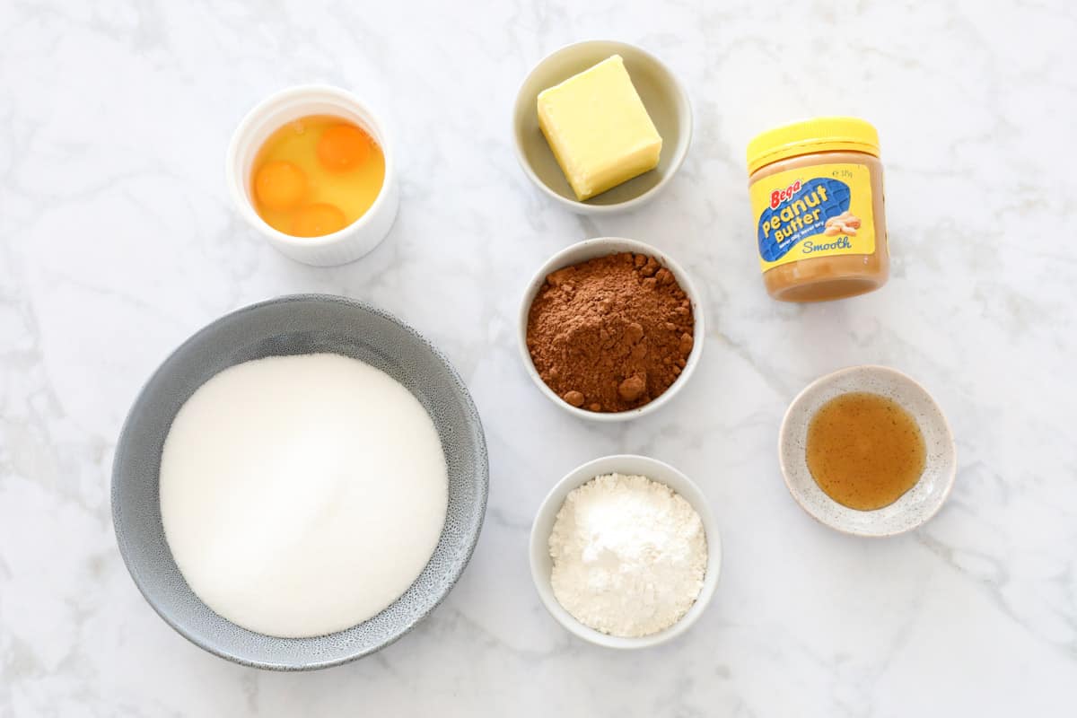 Ingredients to make a fudgy slice in bowls.