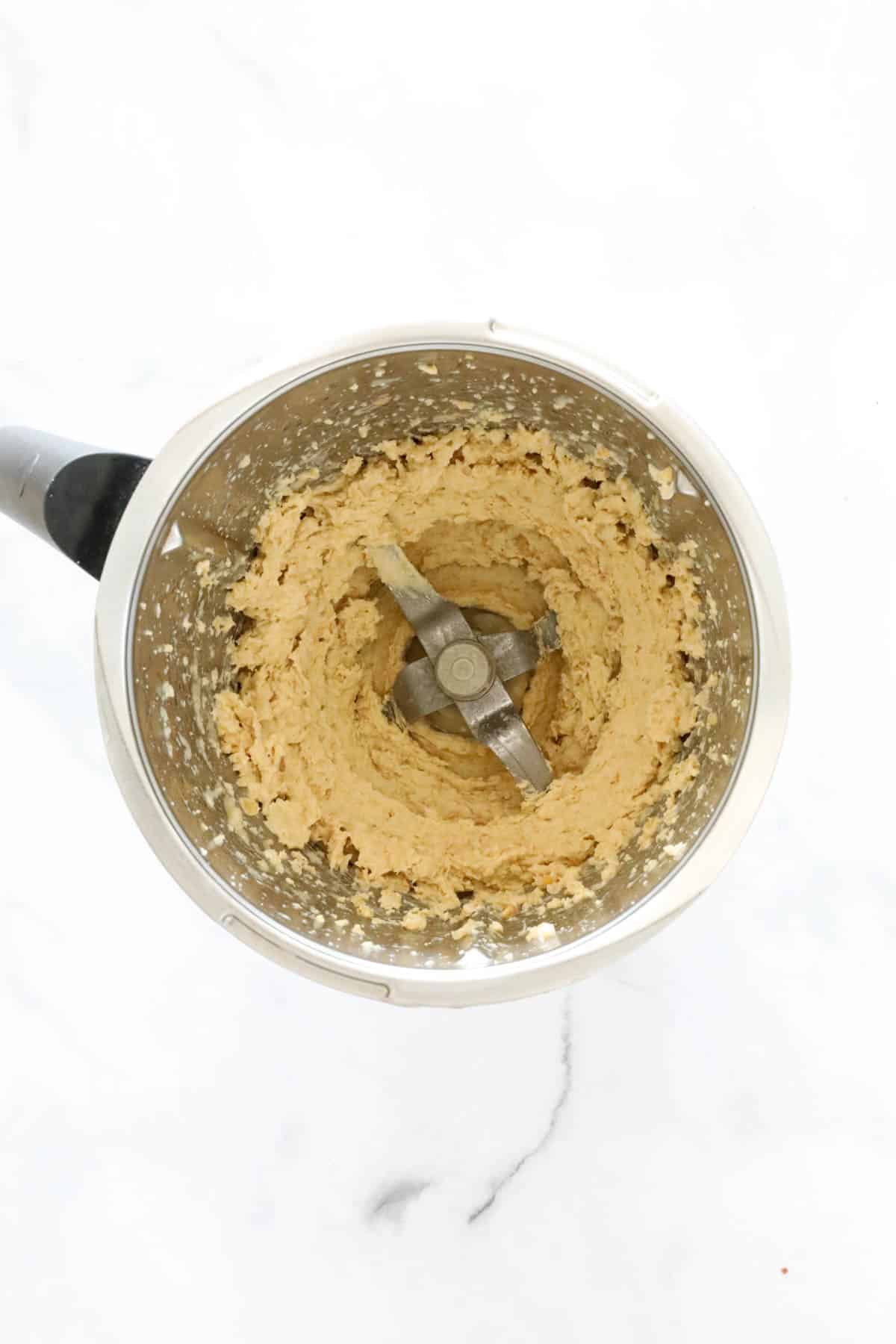 Hummus in a Thermomix bowl.