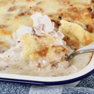 A casserole of creamy chicken and bacon with ranch dressing in a baking dish.