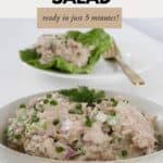 A bowl of creamy tuna salad with more on a lettuce leaf in the background.