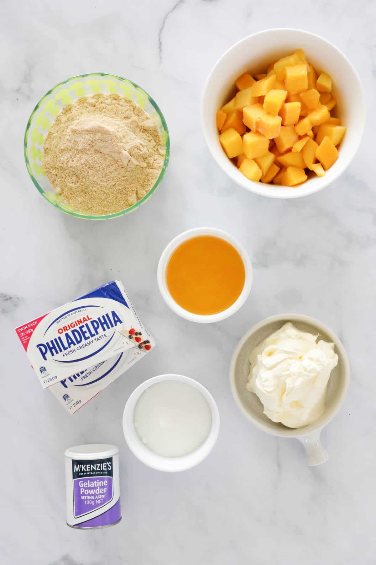 Ingredients for making mango cheesecake.