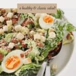 cos lettuce topped with crunchy croutons, crispy bacon, eggs and parmesan cheese.