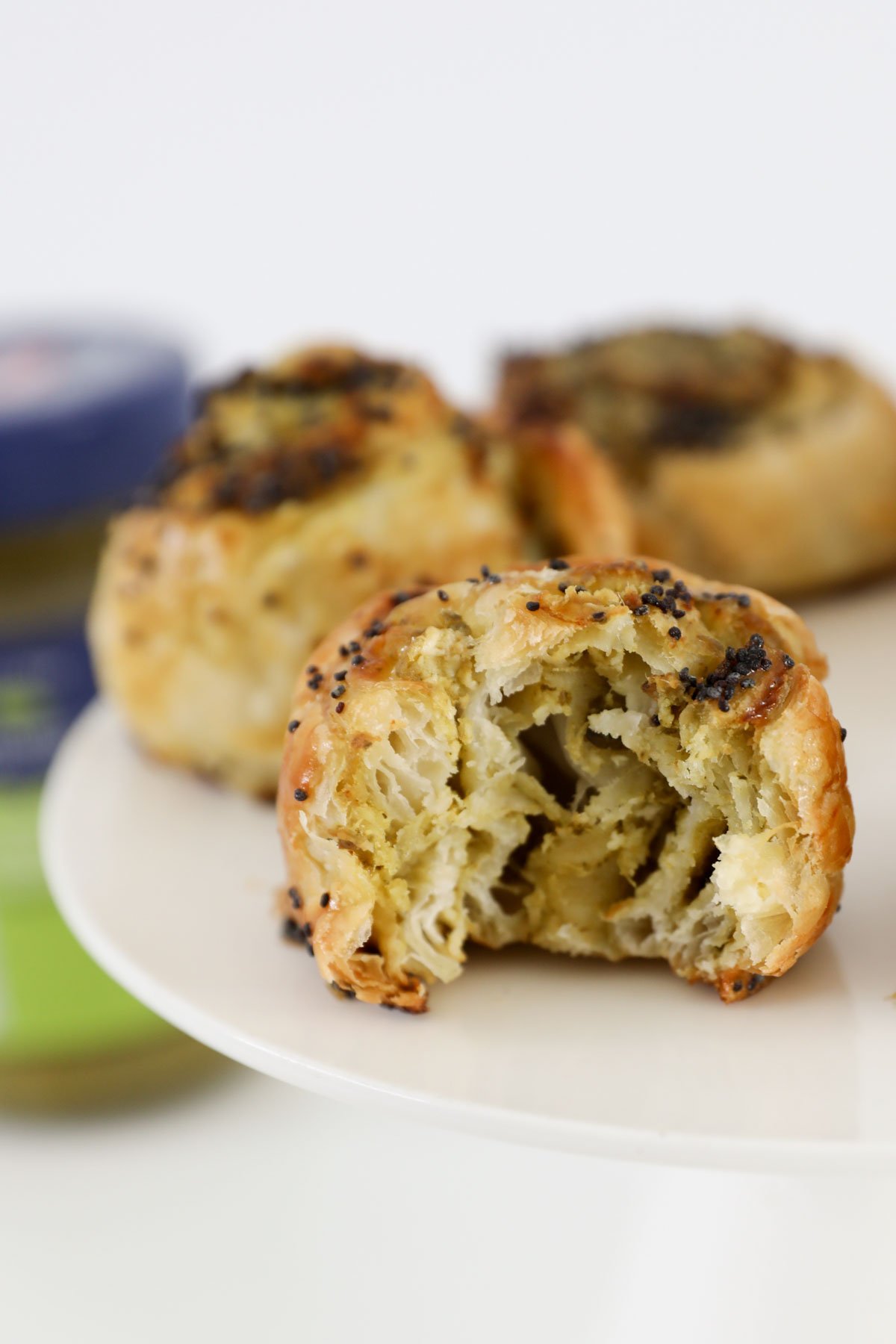 Pesto pastry rolls on a plate.