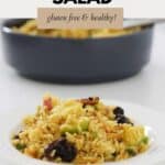 a serve of curried rice salad on a white plate.