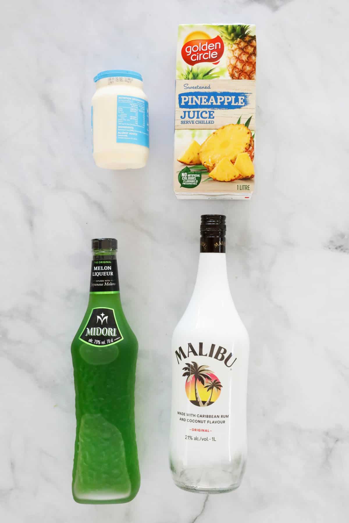 The ingredients for a summer midori cocktail.