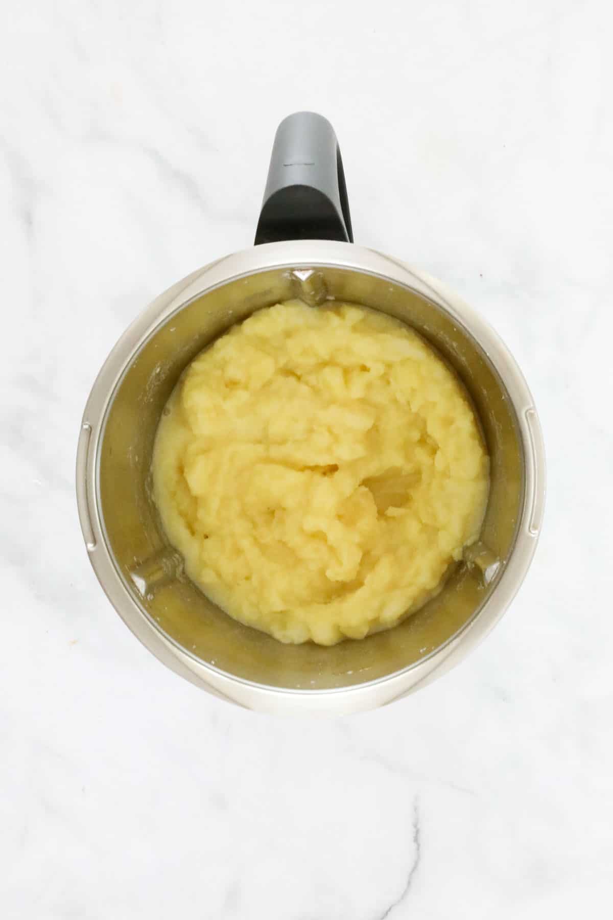 A Thermomix bowl with potato mash.