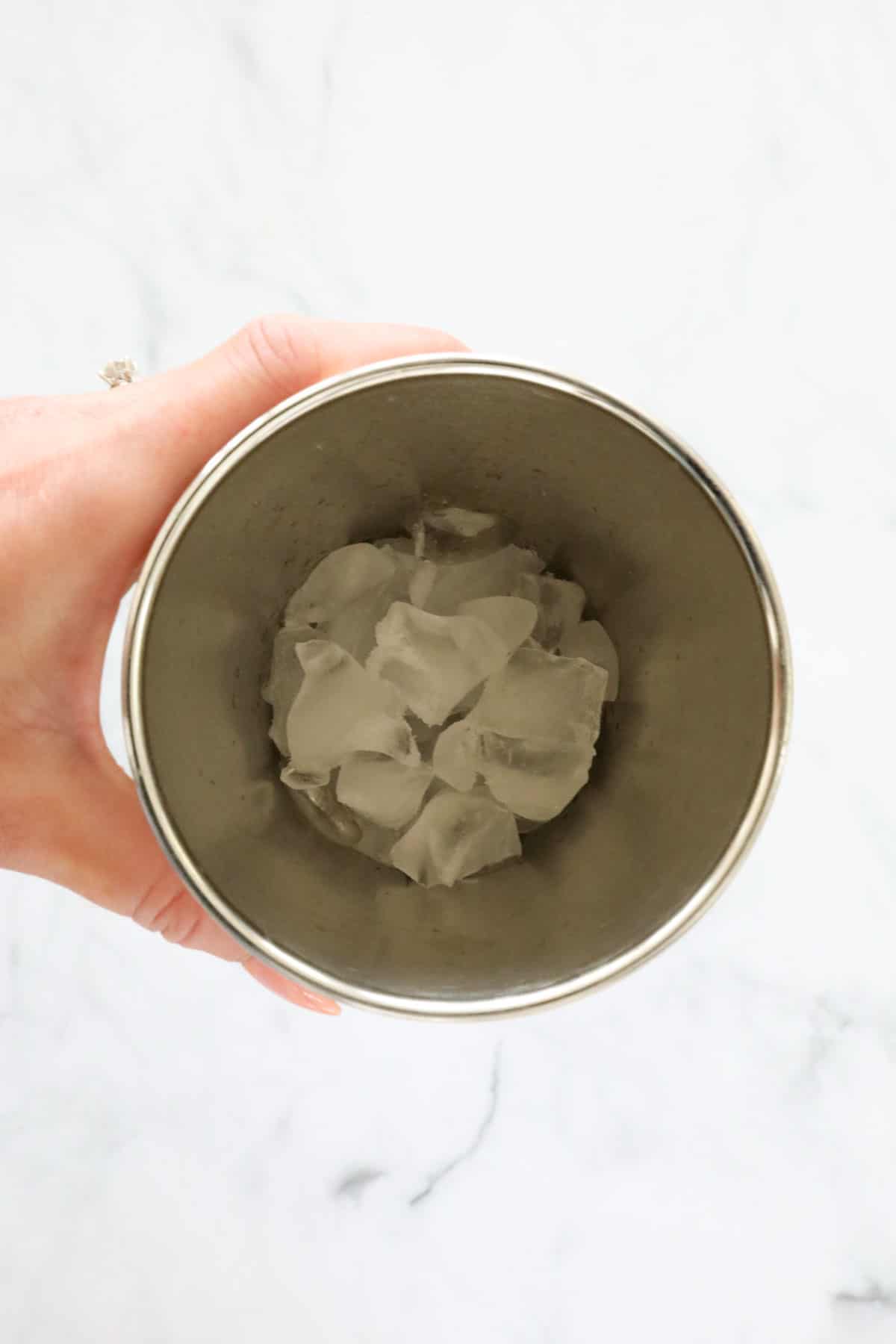 Ice cubes in a metal shaker.