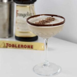 A creamy chocolate cocktail with grated Toblerone on top.