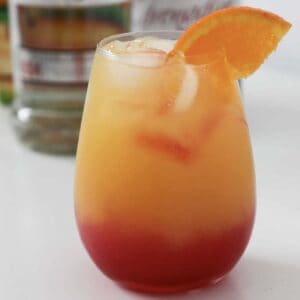 A tropical cocktail with an orange slice.