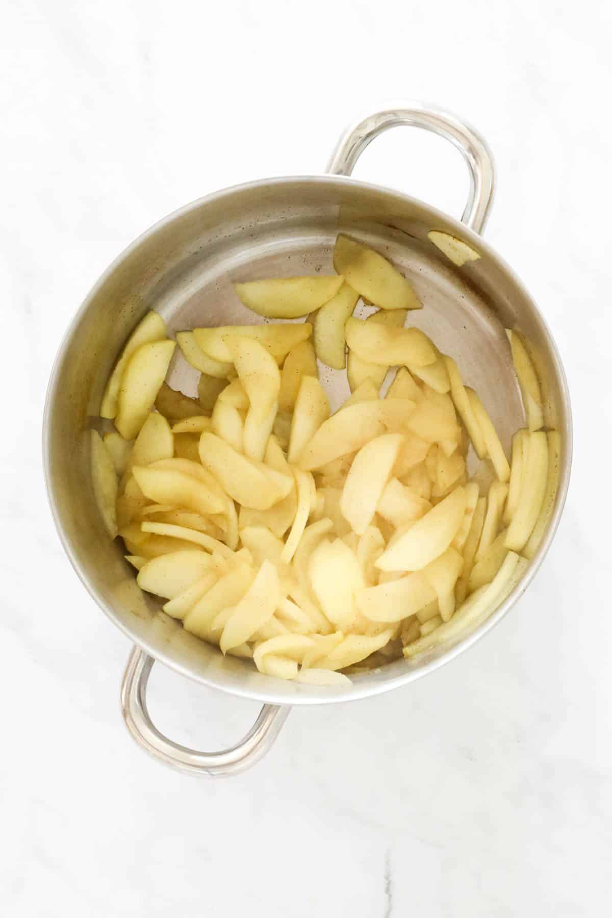 Stewed sliced apple in a pot.