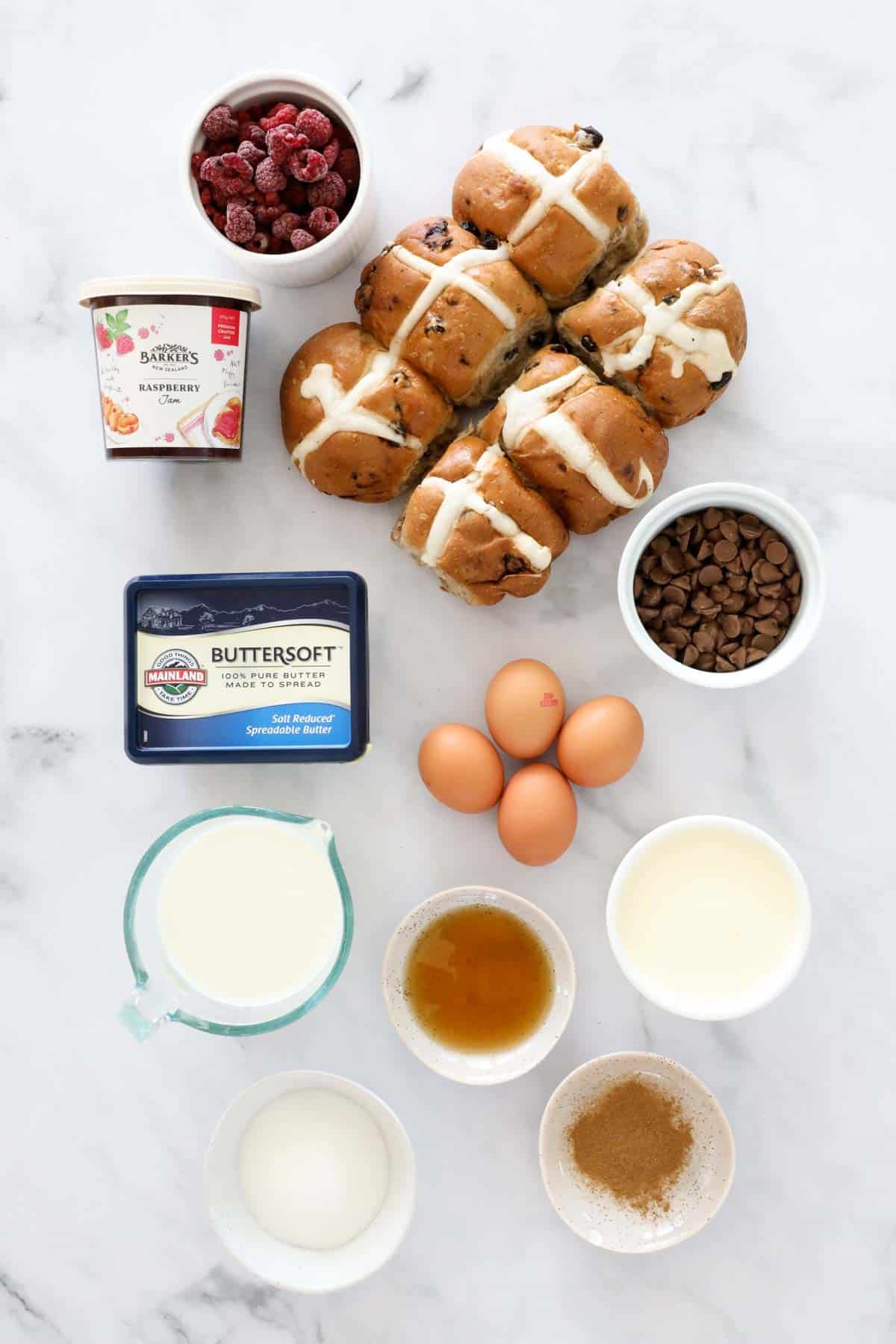 The ingredients for bread and butter pudding made with hot cross buns.