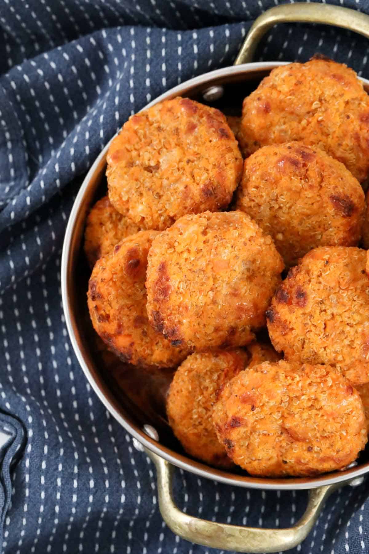 Golden Sweet Potato & Quinoa Bites in a metal serving dish with handles.