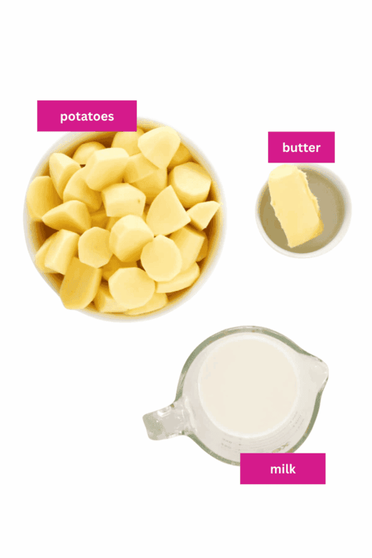 Potatoes, milk and butter in a bowl.
