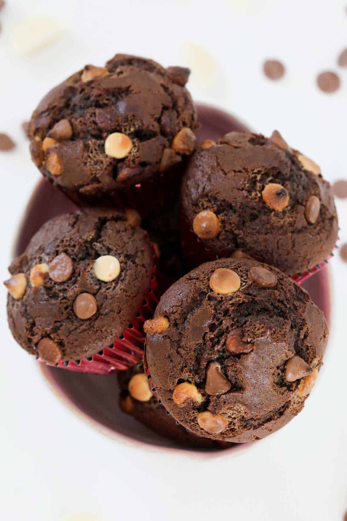 A bowl filled with triple chocolate muffins.