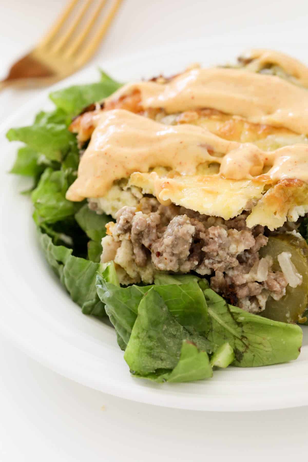 A low carb beef casserole with cheese, lettuce and burger sauce.