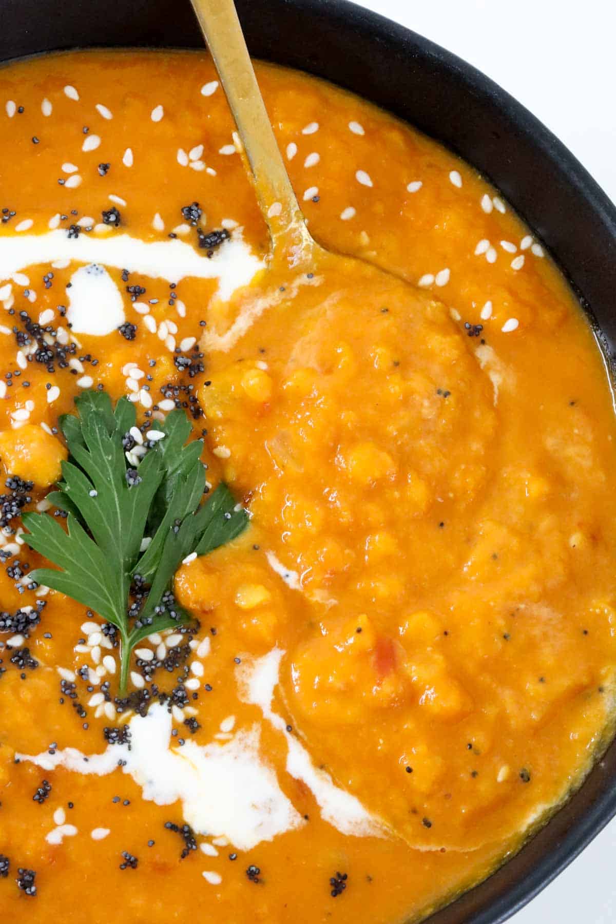 An close up of thick lentil and carrot soup.