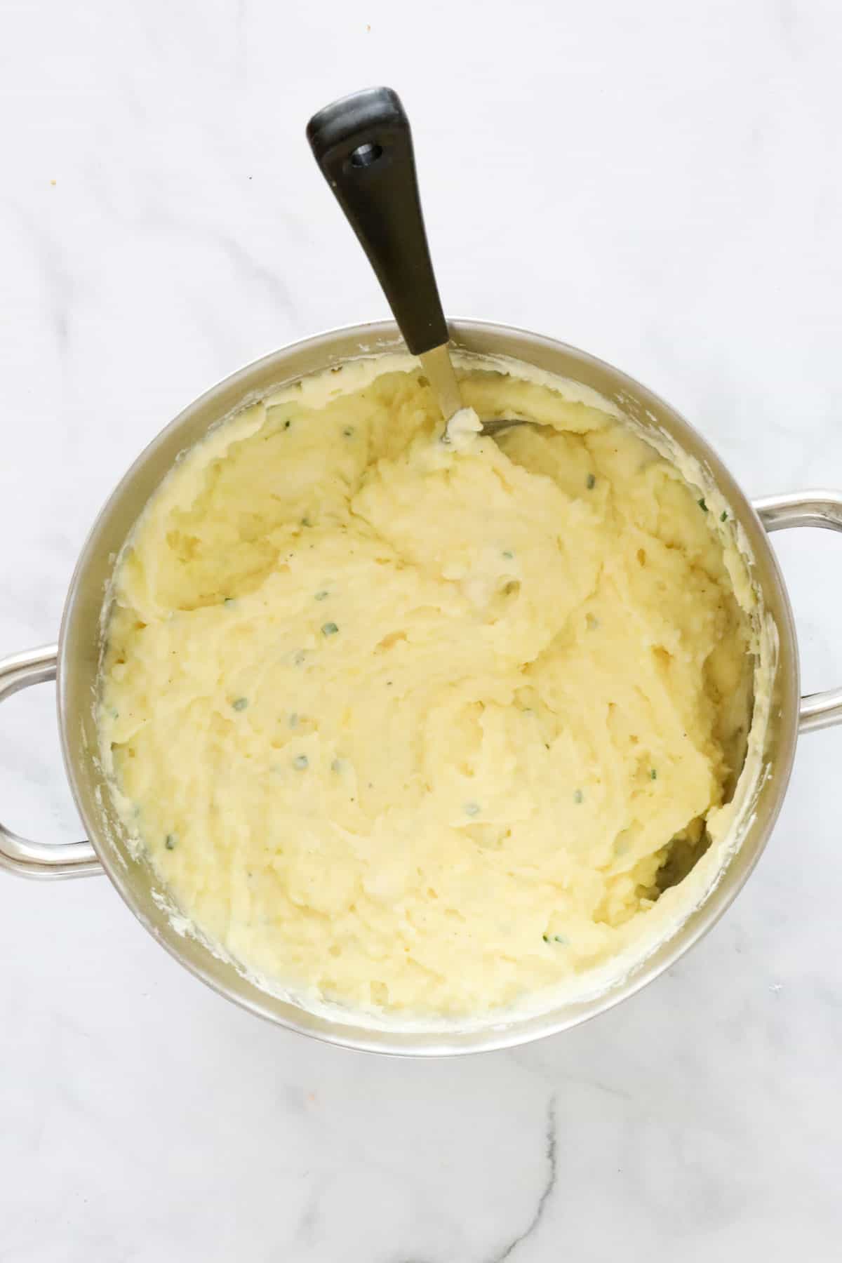 Creamy mashed potatoes in a pan.