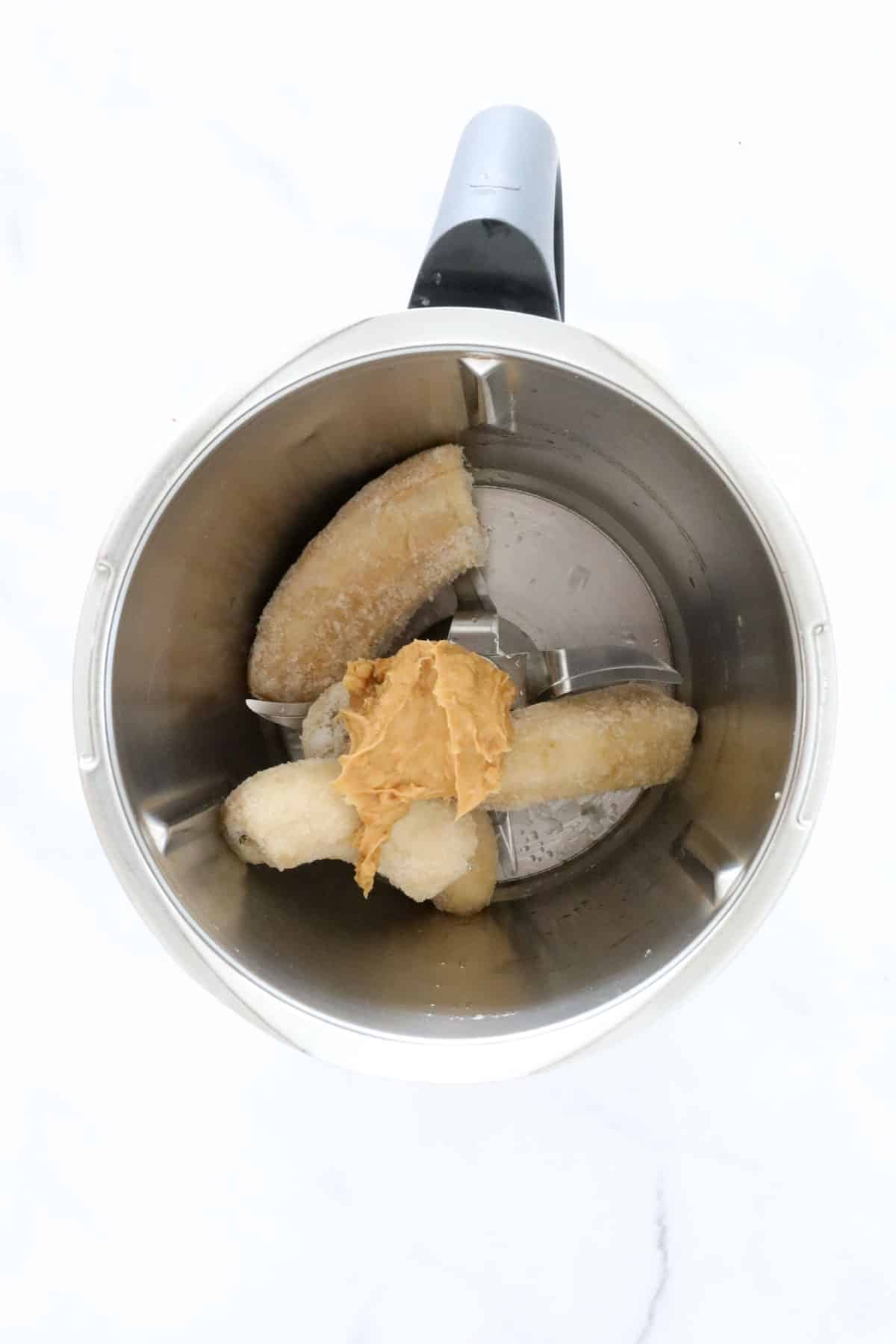 Frozen bananas and peanut butter in a Thermomix