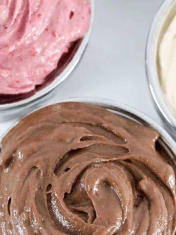 An overhead shot of chocolate, raspberry and peanut butter ice cream.