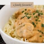 A bowl of creamy beef and mushroom stroganoff, served over egg noodles.
