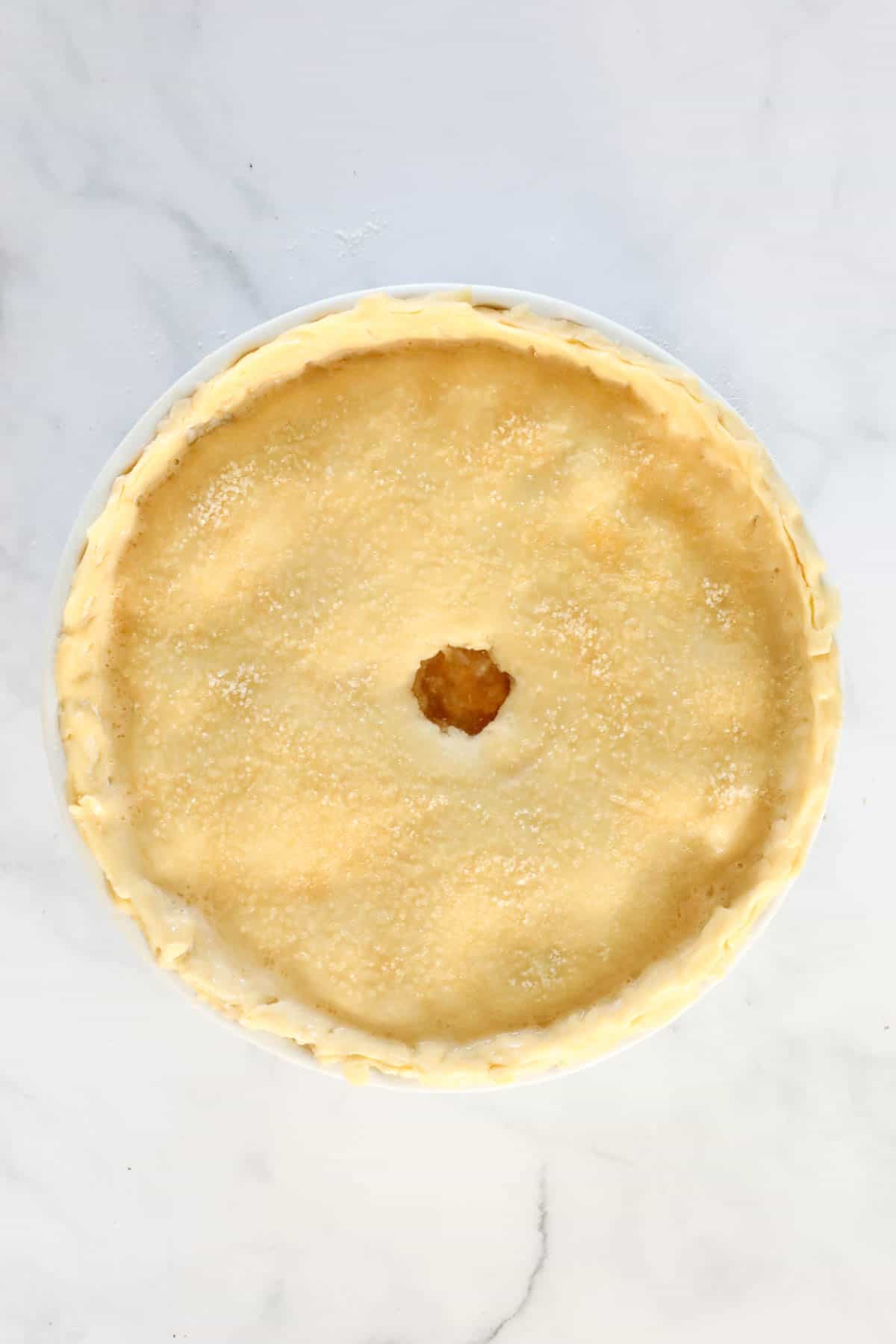 Pastry placed on top of the pie with a hole cut out of the centre.