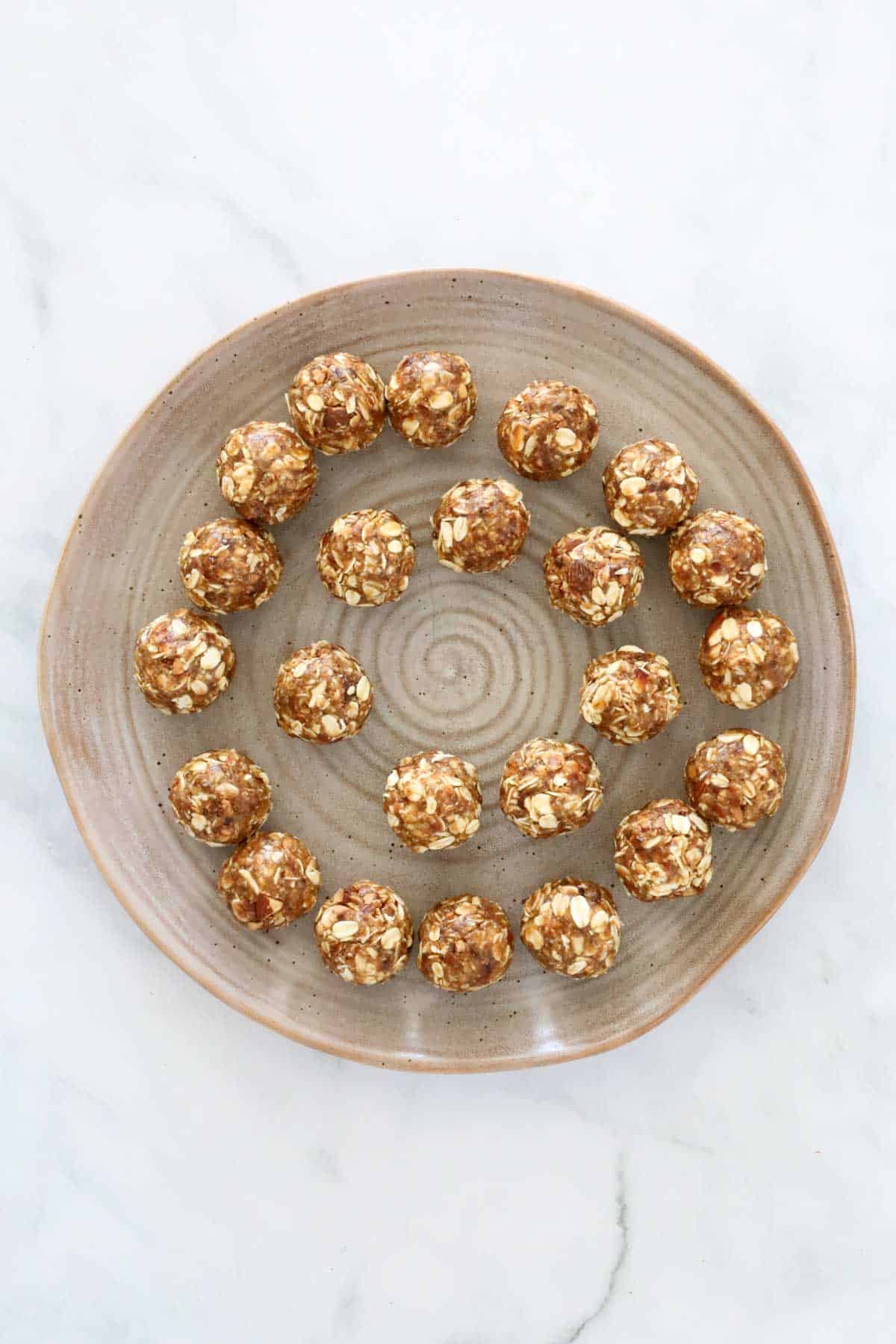 Looking down on a plate of rolled protein balls.