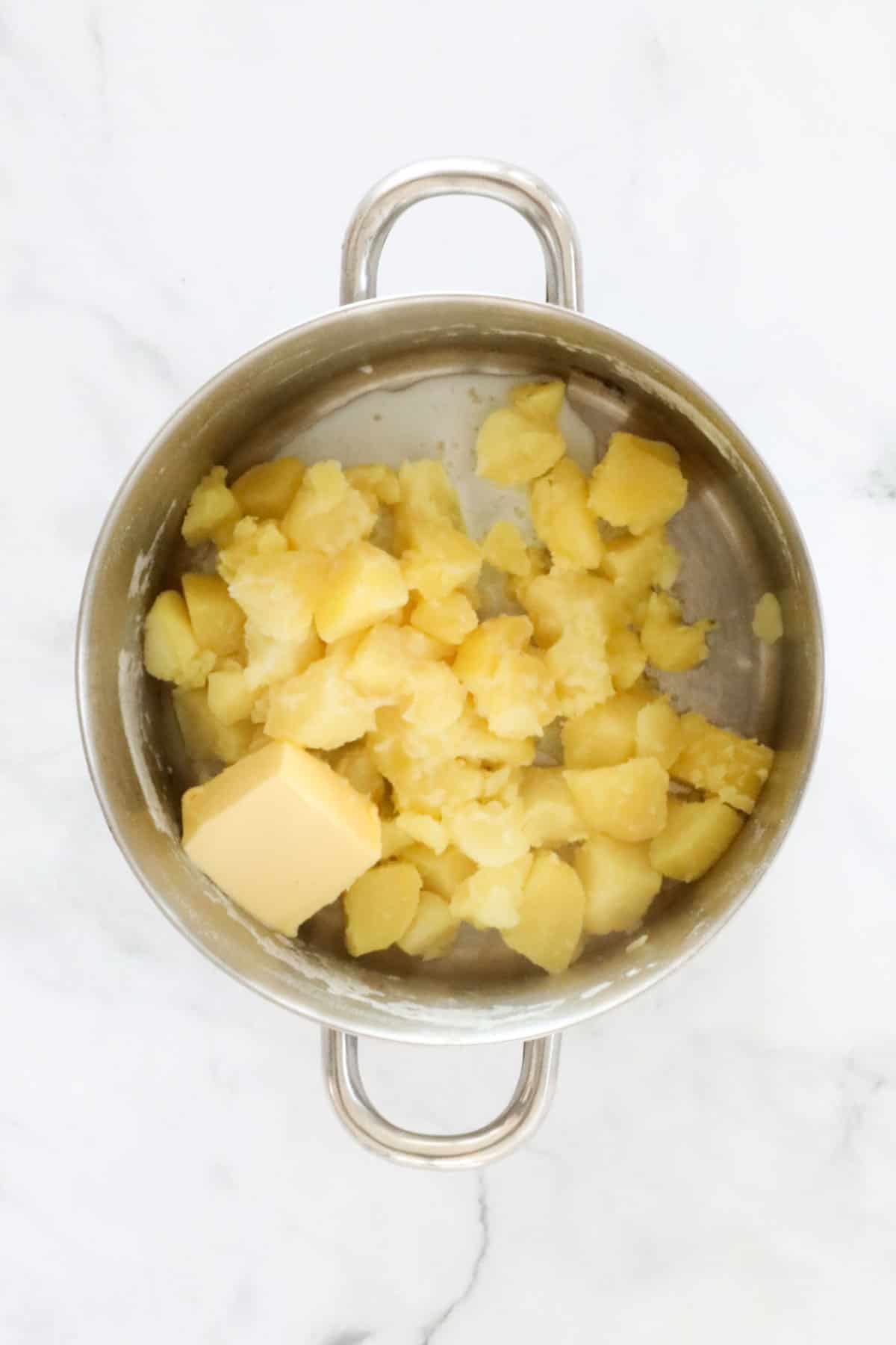 Butter on top of boiled potatoes.