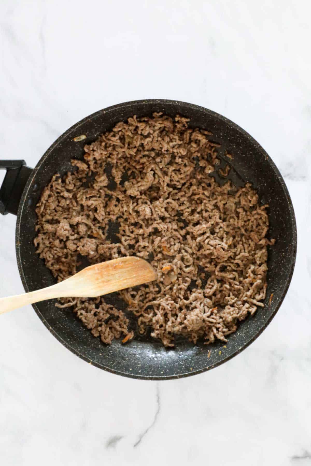 Browned beef mince in a frying pan.
