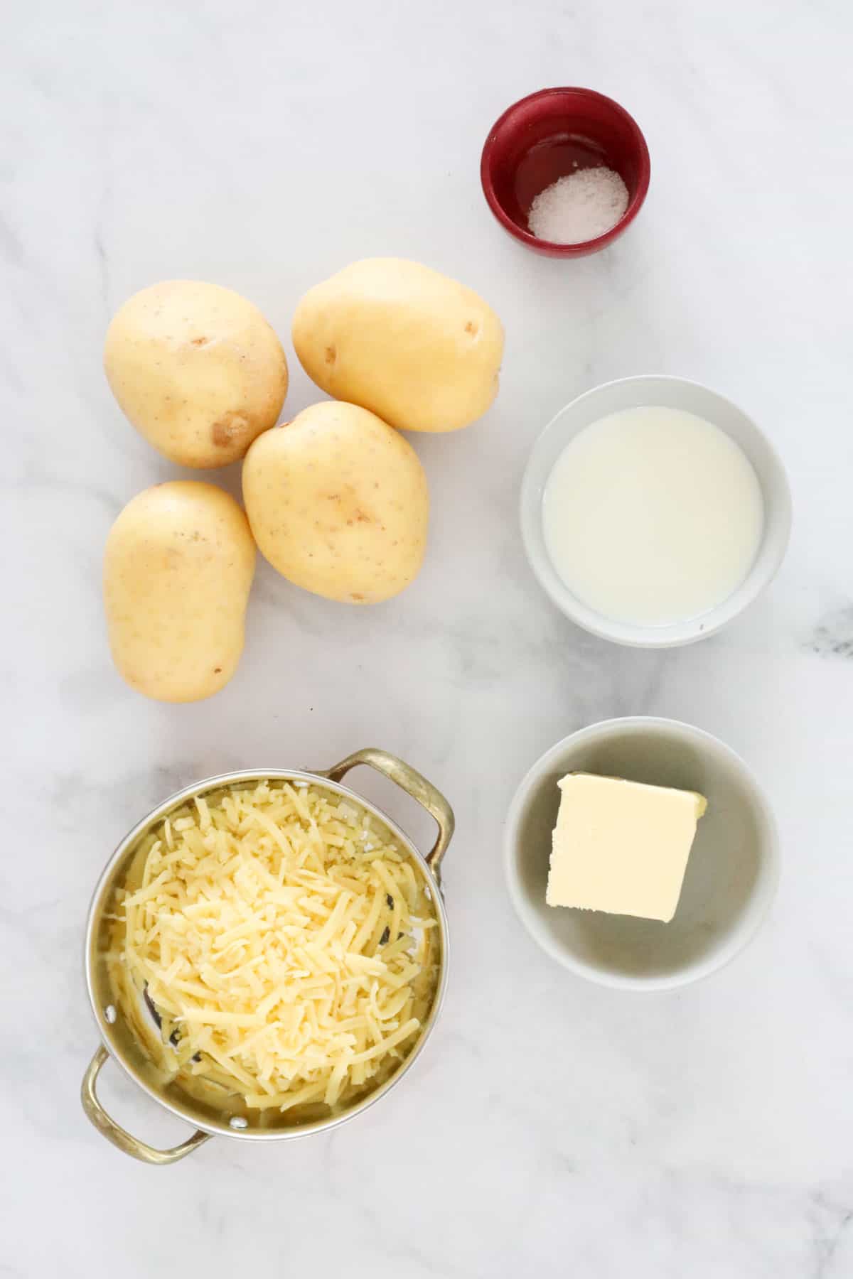 The ingredients for cheesy mashed potato.