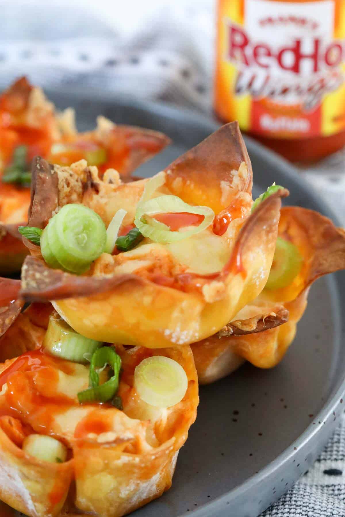 Wonton wrappers filled with creamy hot sauce chicken.