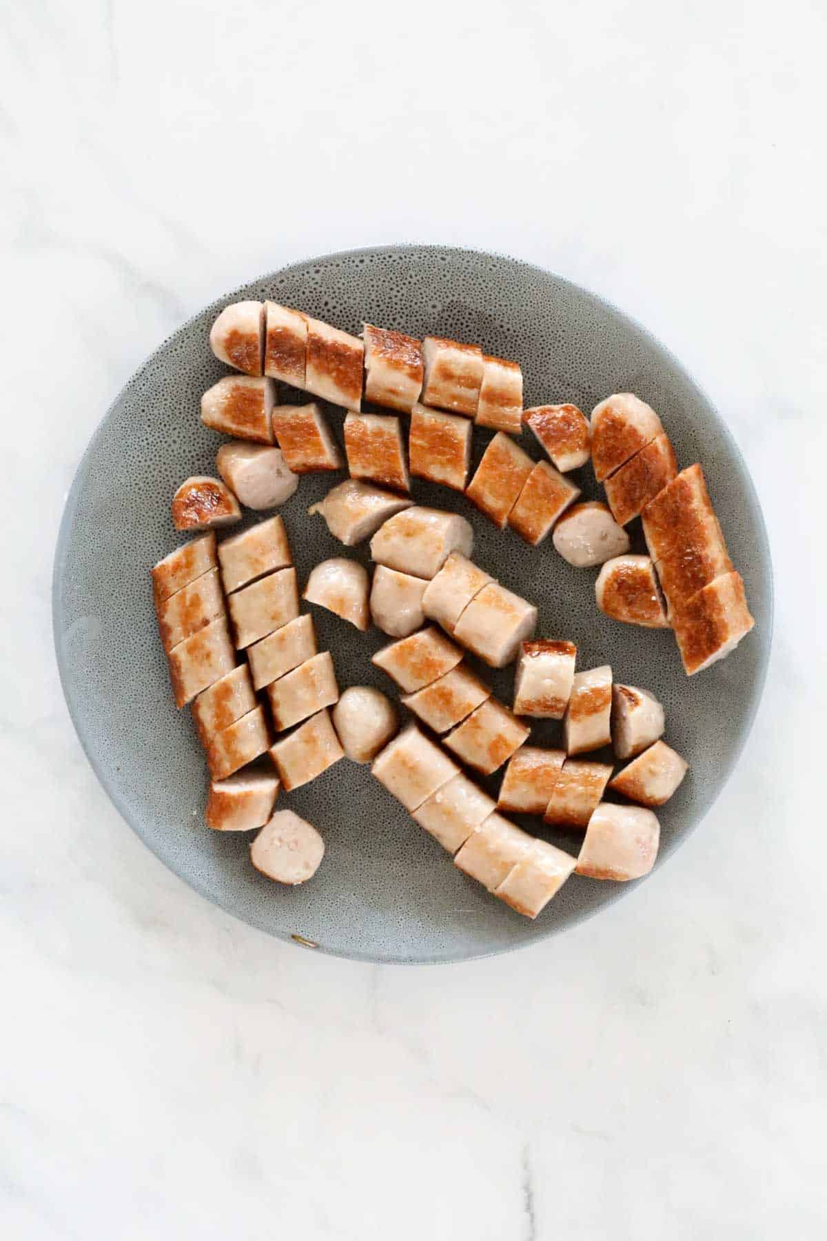 Browned sausages cut into chunks.
