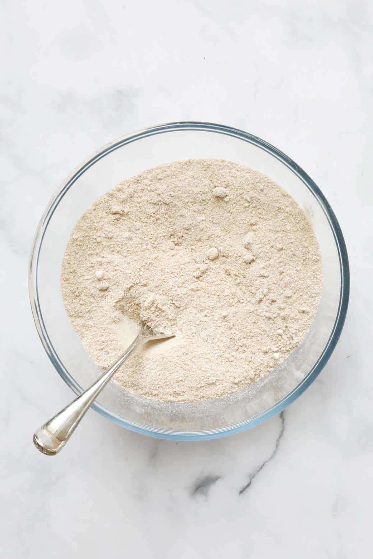 Flour, brown sugar and butter rubbed together in a bowl to the texture of breadcrumbs.