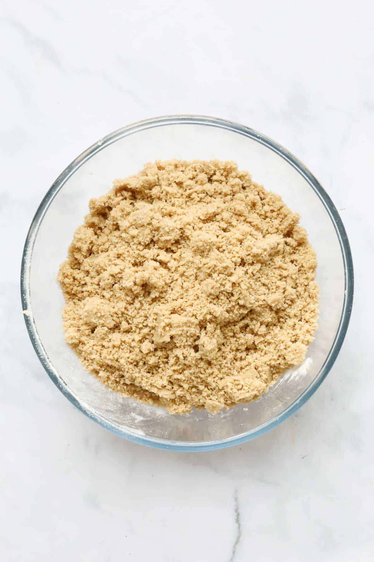 Flour, brown sugar, and almond meal rubbed into breadcrumbs with butter.