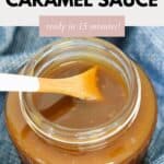 A jar of salted caramel sauce with a wooden spoon in it.