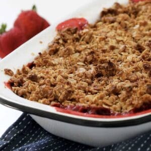 A baking dish filled with strawberry crumble.