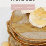 A stack of pancakes with sliced banana and honey.