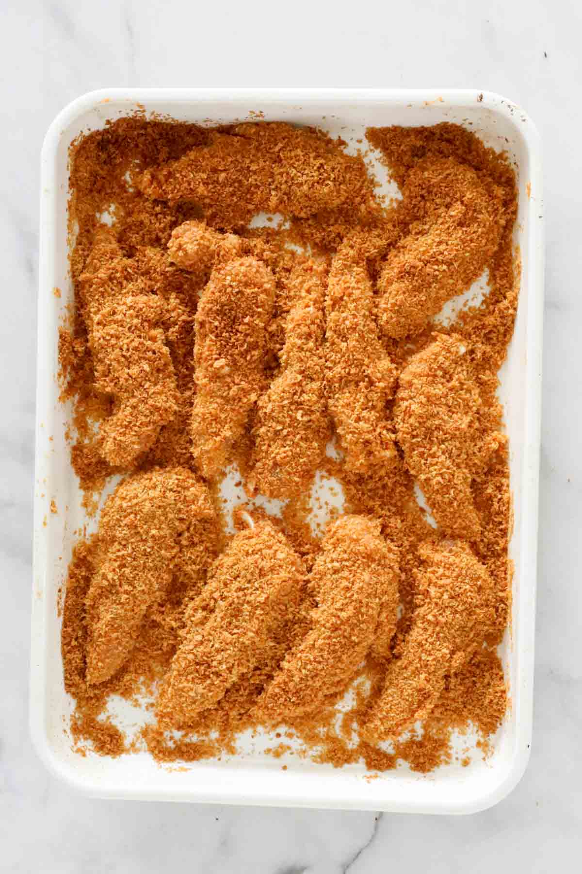 Chicken strips completely coated in crispy panko crumbs.