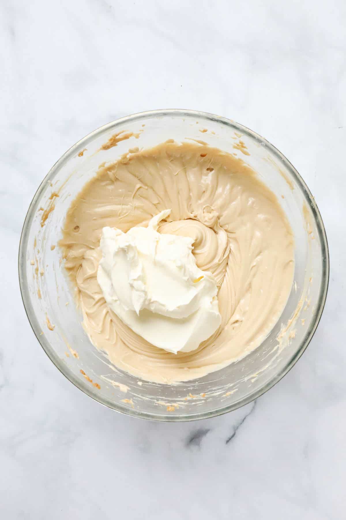 Whipped cream on top of cream cheese mixture.
