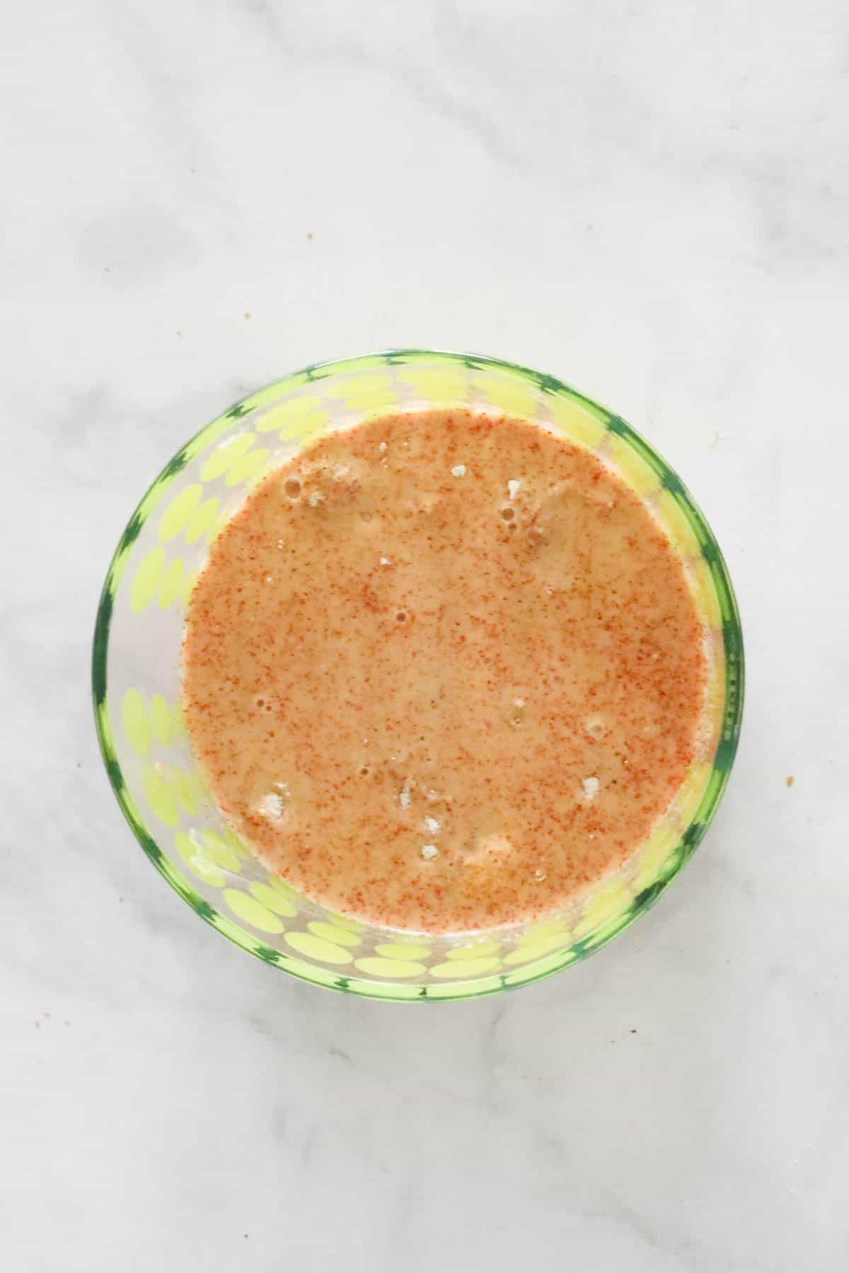 A buttermilk paprika marinade in a bowl.