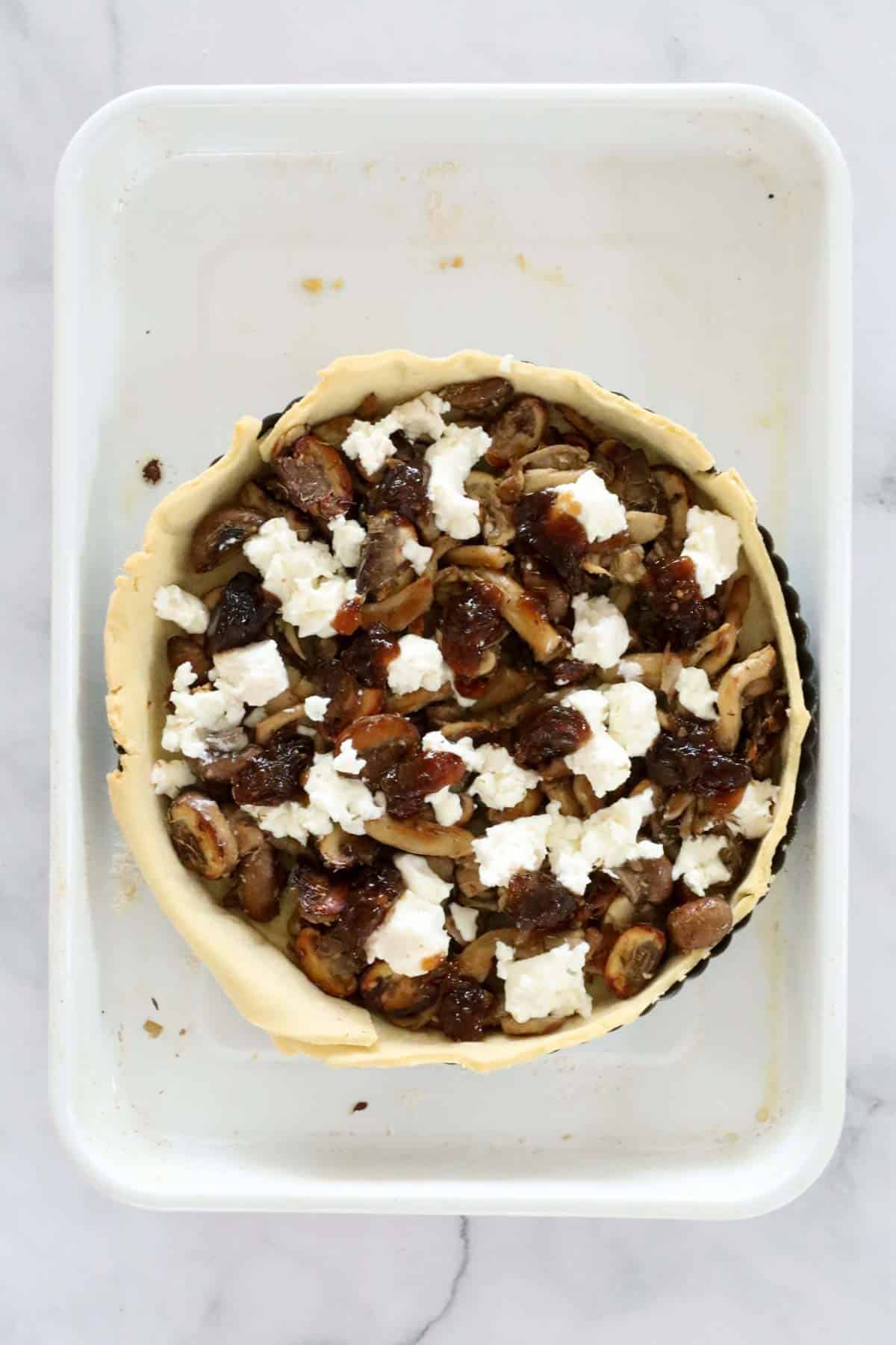 Fried mushrooms, goats cheese and caramelised onions spread over a cooked pastry shell.
