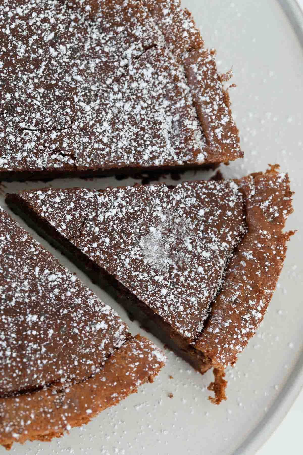 Baked Nutella cake sprinkled with icing sugar.