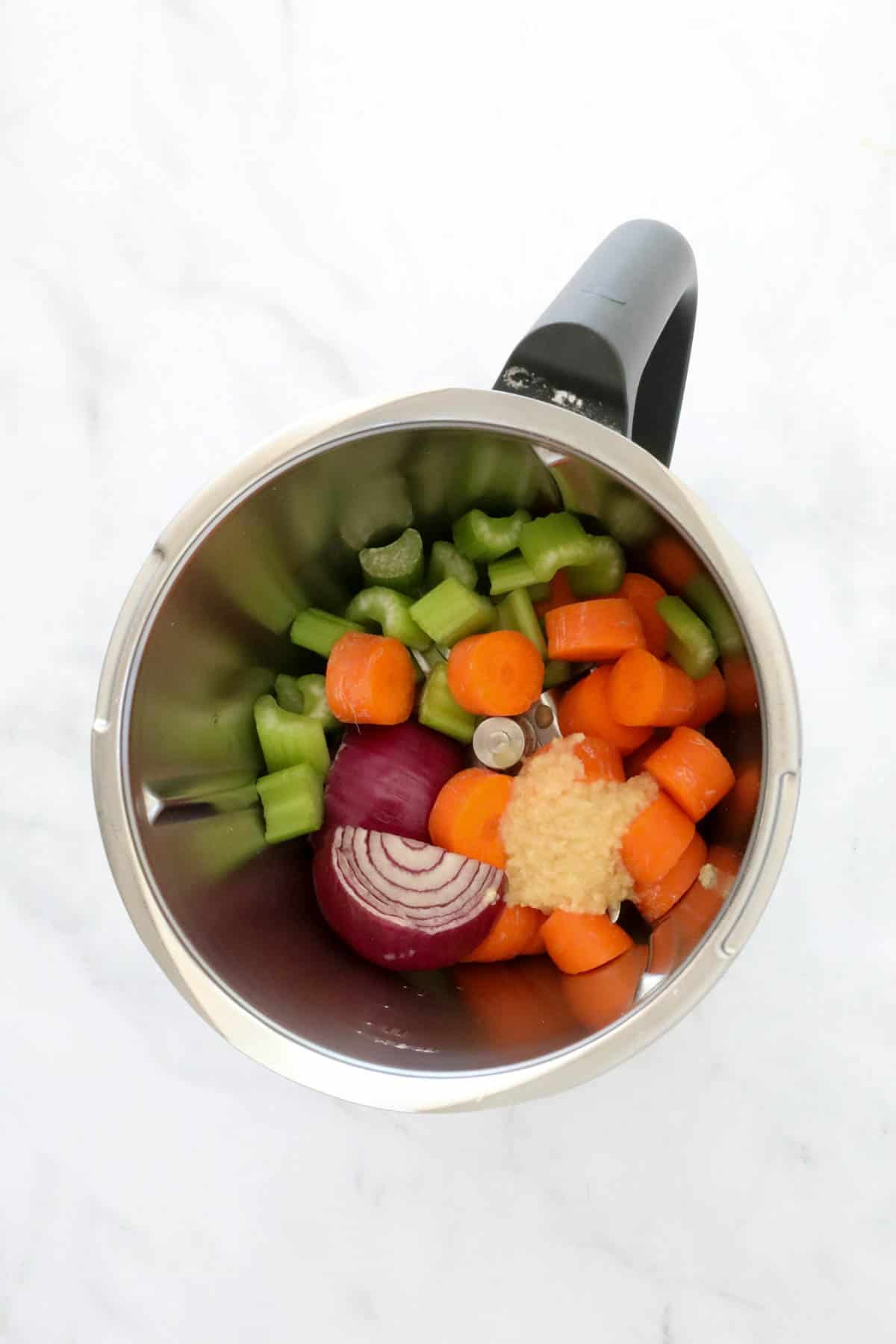 Roughly chopped vegetables in a Thermomix.