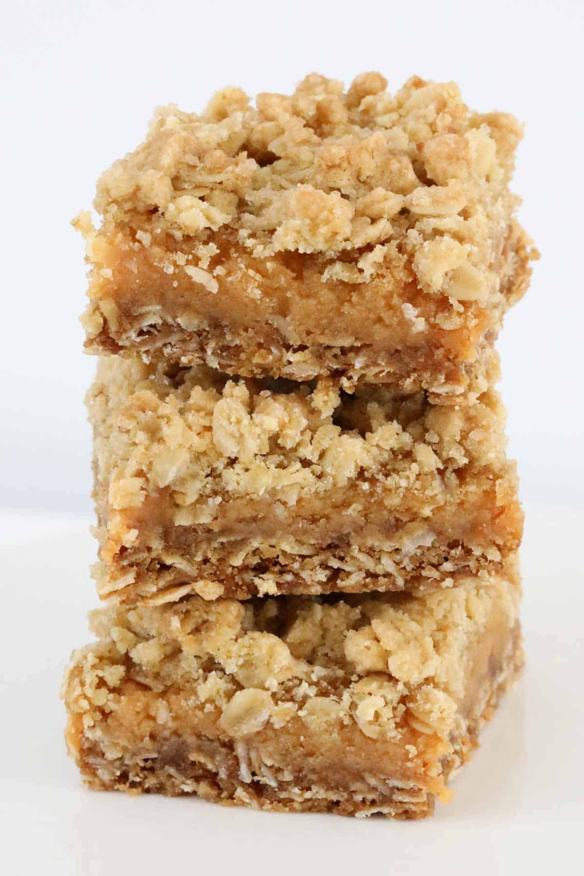 A close up of oaty caramel crumble squares.