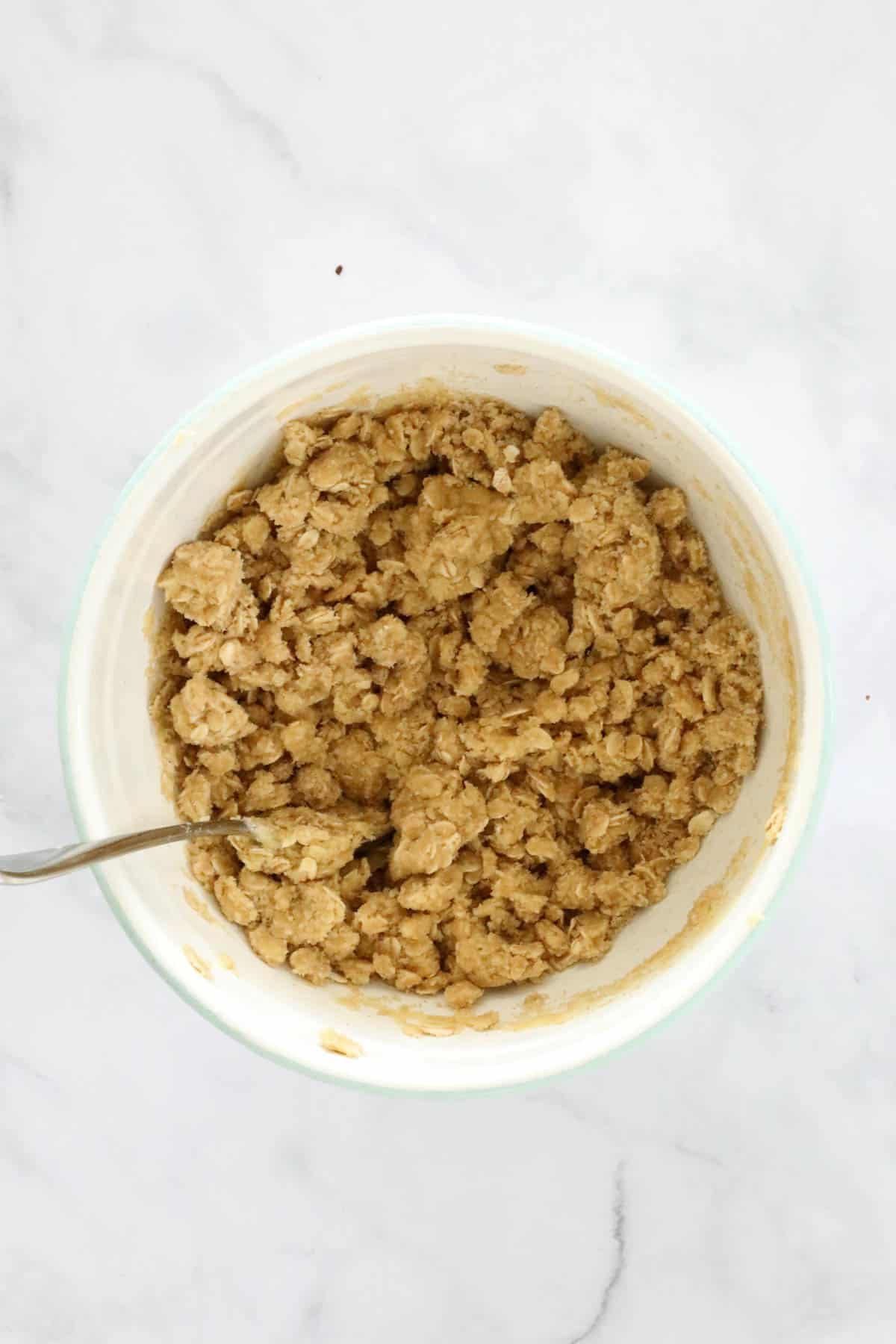Crumble mix after melted butter added to flour and sugar.