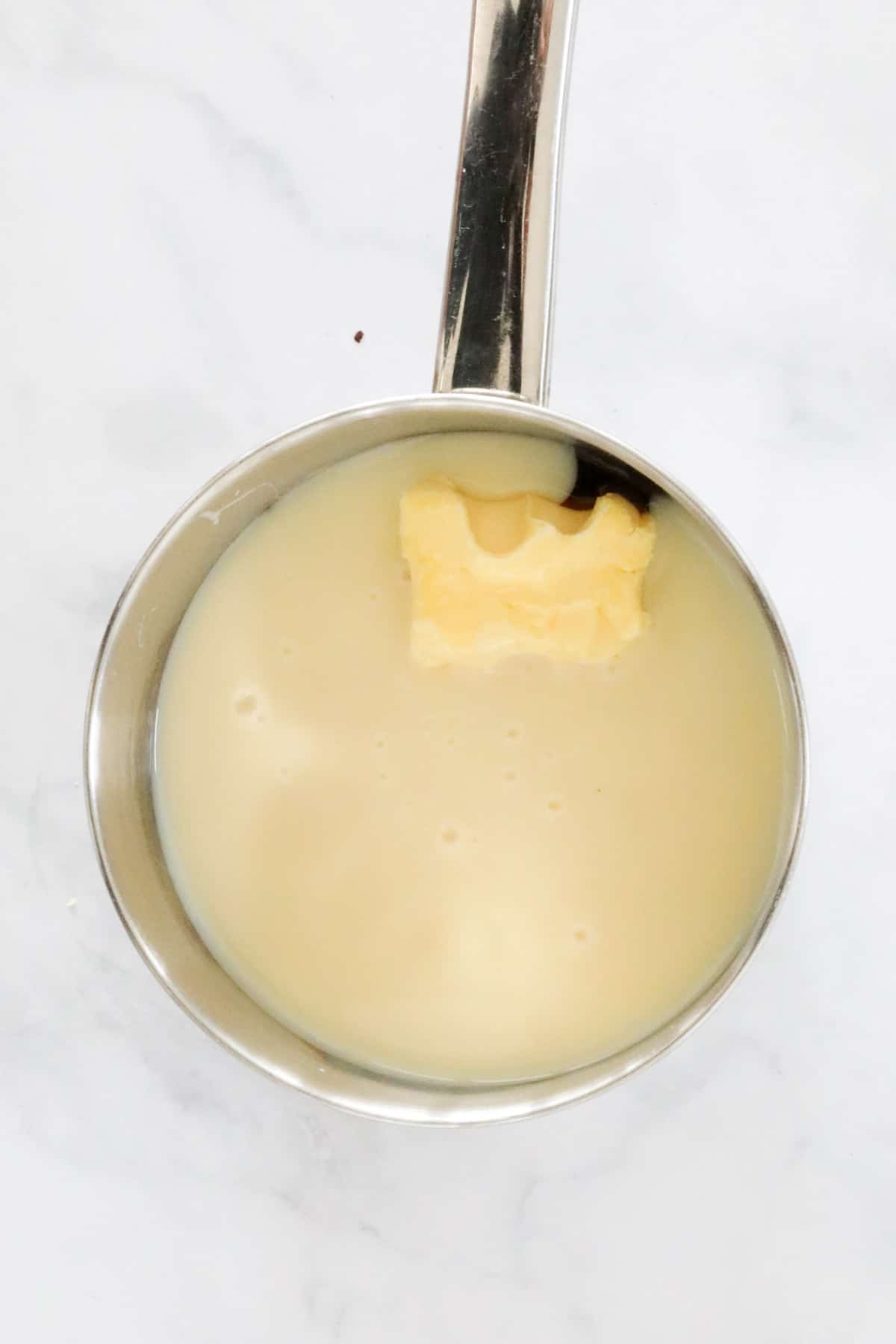 Sweetened condensed milk, golden syrup and butter in a small saucepan.