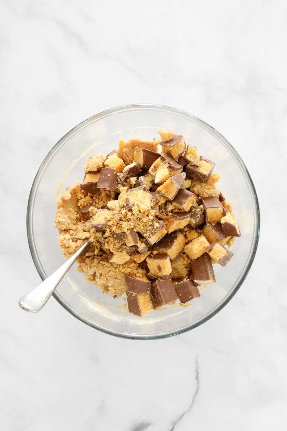 Chunks of Crunchie bar added to crushed biscuit mix.